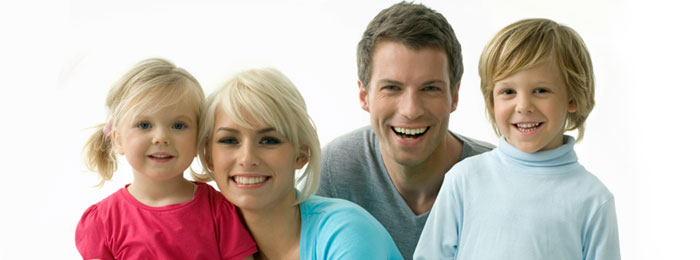 Family smiling with nice white teeth